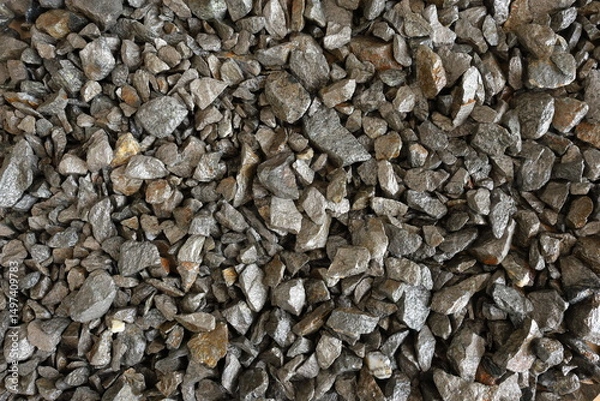 Fototapeta Nickel mine, mining. Background concept with flat lay of pentlandite ore. Rocks, textured. Used in alloys such as stainless steel, nickel-cadmium rechargeable batteries, coins