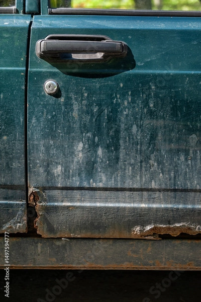 Fototapeta Damaged vintage rusted car texture with peeling paint and corroded metal
