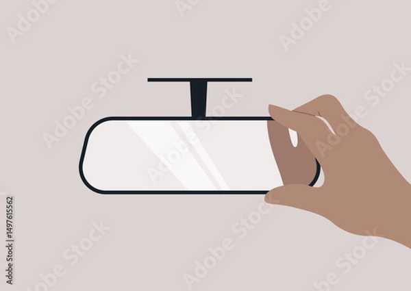 Obraz A hand reaches toward a rear view mirror, positioning it for optimum reflection, It captures the intention to ensure safety and awareness on the road ahead