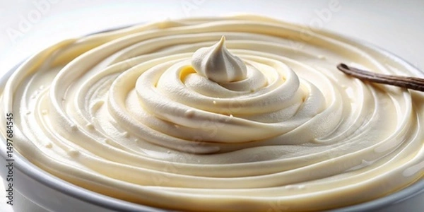 Fototapeta Creamy Vanilla Pastry Filling Swirled in a Bowl with a Vanilla Bean