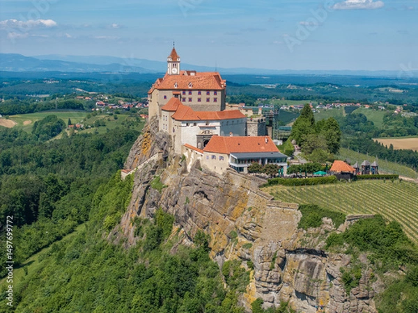 Fototapeta Austria - The Riegersburg castle surrounded by a beautiful landscape Located in the region of Styria from drone view