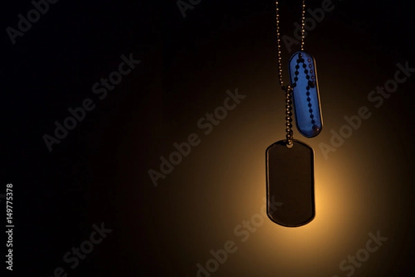 Fototapeta Military ID tags on a dark background