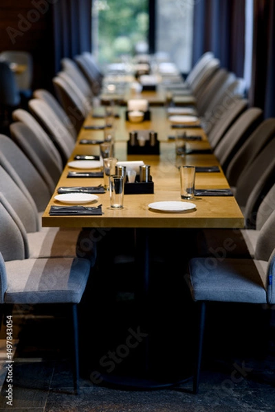 Fototapeta Table setting. Close-up photo of empty glasses, plates and spoons