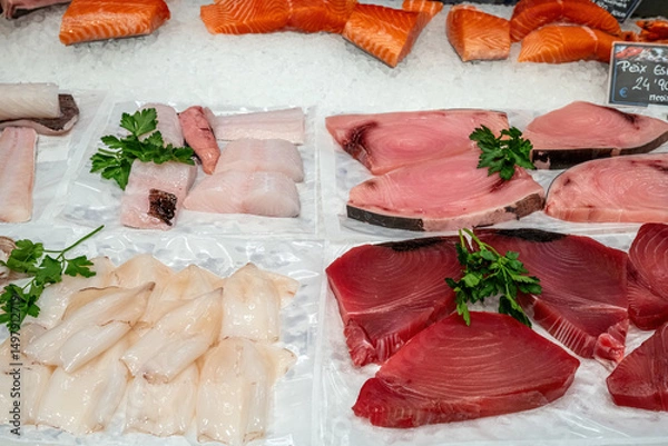 Fototapeta Different kinds of fish fillets for sale at a market in Barcelona, Spain