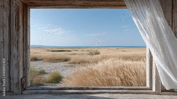 Fototapeta old wooden window in a rustic cottage, view of a golden wheat field