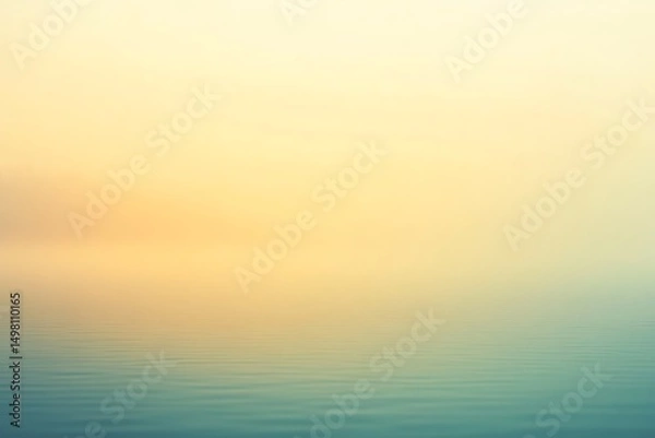 Fototapeta Tranquil landscape featuring a lake shrouded in soft, golden mist at sunrise, creating a serene and peaceful atmosphere