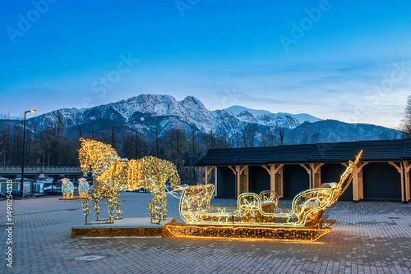 Fototapeta Christmas lights with Tatry mountains in Zakopane. Poland
