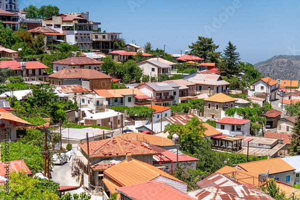 Obraz Pedoulas village in Cyprus showing colorful houses covering the mountainside on a sunny day