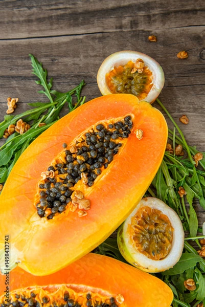 Obraz Papaya fruit on a table background. Slices of sweet papaya