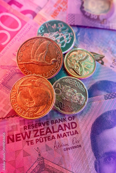 Obraz Coins and banknotes are issued by the Reserve Bank of New Zealand, which controls monetary policy affecting the NZ economy by setting the official cash rate. 