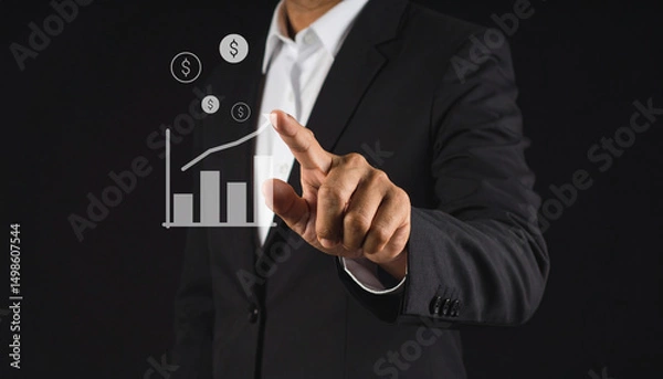 Obraz A man in a suit points to a virtual graph with increasing bars and dollar signs, symbolizing financial growth and business success.