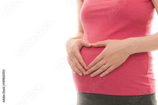 Fototapeta お腹に手を当てる妊婦