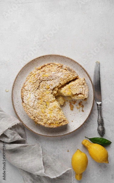 Obraz Freshly Baked Lemon Pie, Delicious Citrus Tart on the plate with cut piece, top view, copy space