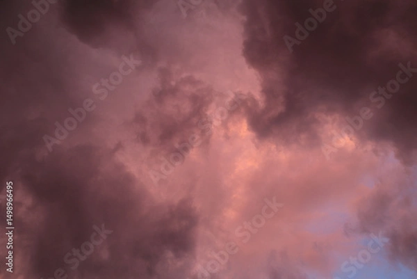 Obraz Fiery red storm clouds with dramatic lighting. Red storm clouds background. Dramatic red sky.