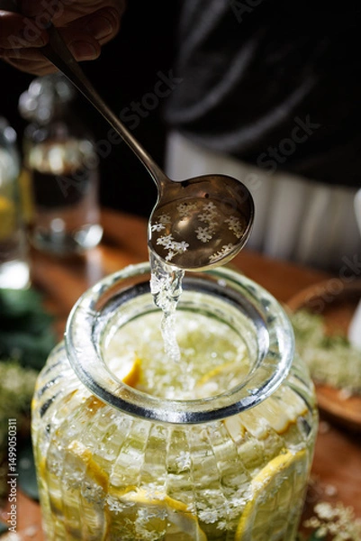 Obraz Close up of preparation of elderberry flower syrup, soft light with deep shadows.