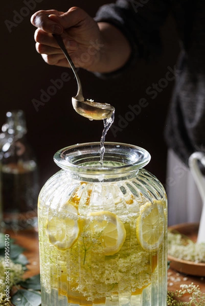Obraz Close up of preparation of elderberry flower syrup,  soft light with deep shadows.