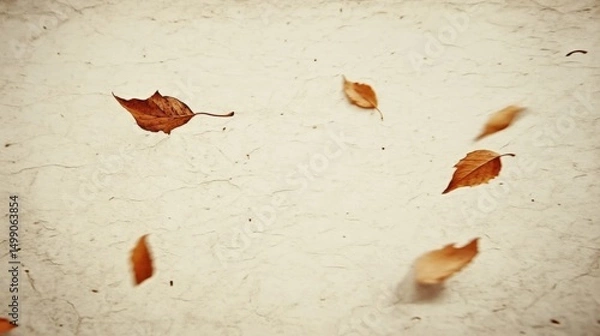 Fototapeta Falling Dry Leaves on a Textured Surface in Soft Natural Light