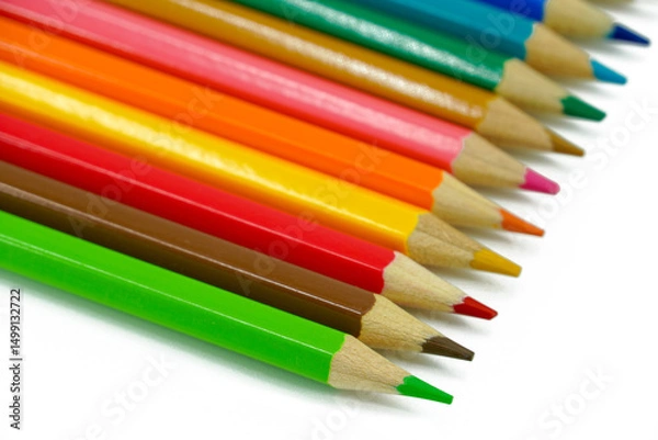 Fototapeta Bunch of fun mini colored pencils isolated on white. Multicolor group of cute small wooden pencils.
