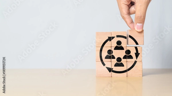Obraz Manpower planning and management concept. Forecasting future staffing needs, analyzing current staffing levels and developing human resource strategies. Wooden blocks with manpower or staffs icons