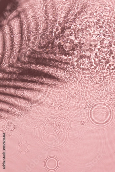 Obraz Pink water texture background on the noon sunlight with tropical leaves shadow.
