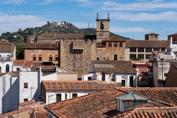 Fototapeta Panoramic view of the medieval city of Caceres (UNESCO world Heritage Site), Spain, with the towers an churches since a lookout in a sunny day.