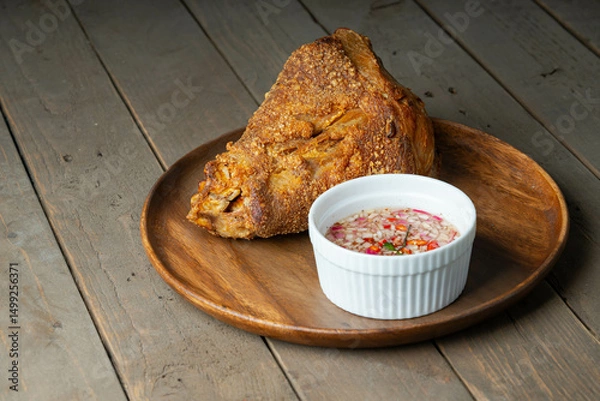 Fototapeta a delicious famous dish in the Philippines, deep fried pork leg also known as crispy pata 