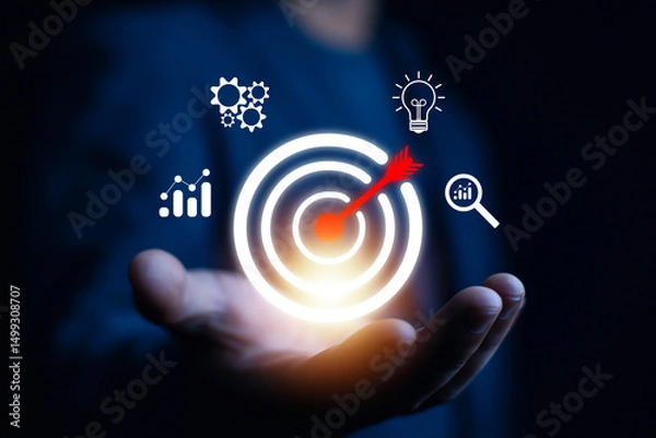 Obraz Businessman showing virtual target icon for business purpose, strategic planning for business growth and target customer group. Set business objectives goals, value, growth.	
