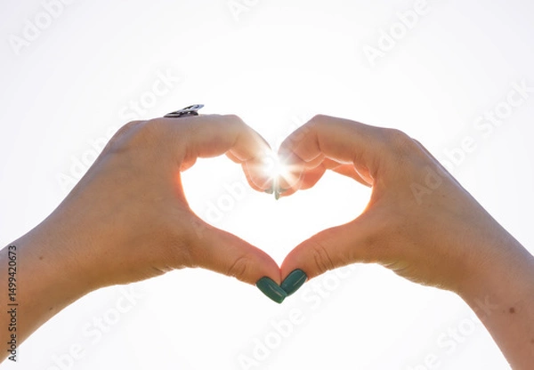 Fototapeta Woman making heart on white background