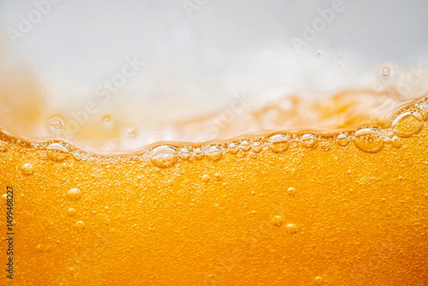 Fototapeta Close up bright orange Oil or beer splash texture and nature waves, Beautiful waves curve and little bubbles smooth for graphic design and background, Oil Bubbles, Soft beer bubbles, Selective focus