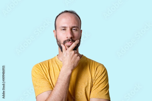 Fototapeta portrait of young man confused an uncertain, shrugging with open hands. Bewildered and clueless person