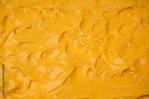 Fototapeta Yellow sauce splashes as a background.