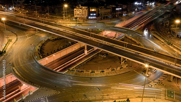 Obraz Expressway, Self-driving autonomous electric cars of the future with HUD elements move along a busy traffic intersection. Concept: Artificial Intelligence, Car Scan, GPS Tracking, Smart Roads, IoT