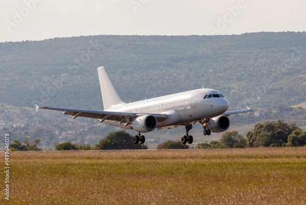 Fototapeta Passenger Jet Landing. Commercial Airliner on Final Approach to Runway. Aviation and Travel.