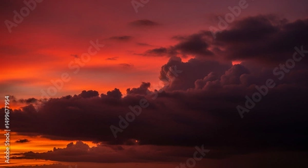 Obraz Vibrant sunset sky with dramatic dark clouds