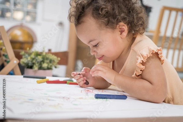 Obraz Happy moment little cute girl creating and water color painting activity with paint brushes on frame canvas at living room. Kids activity. Child physical. Emotional. Cognitive development concept.	