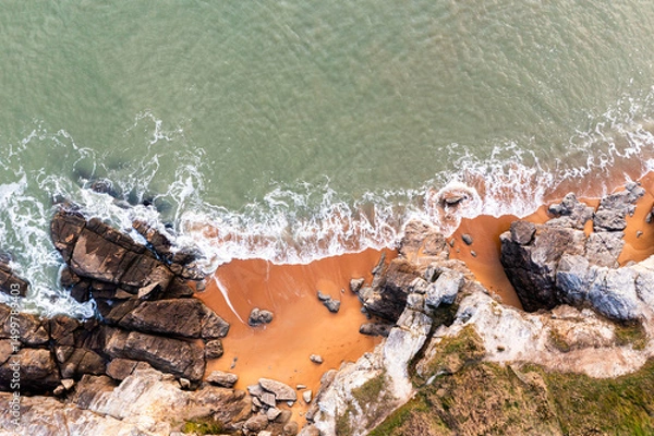 Obraz Beautiful ocean landscape from a drone. View of the ocean, rocks and sand.
