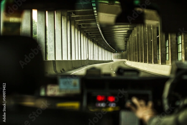 Obraz View towards road from inside an Uber car