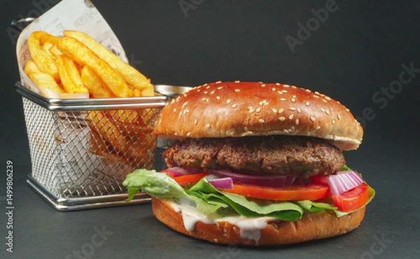 Fototapeta Fresh beef burger with Crispy French fries on black background