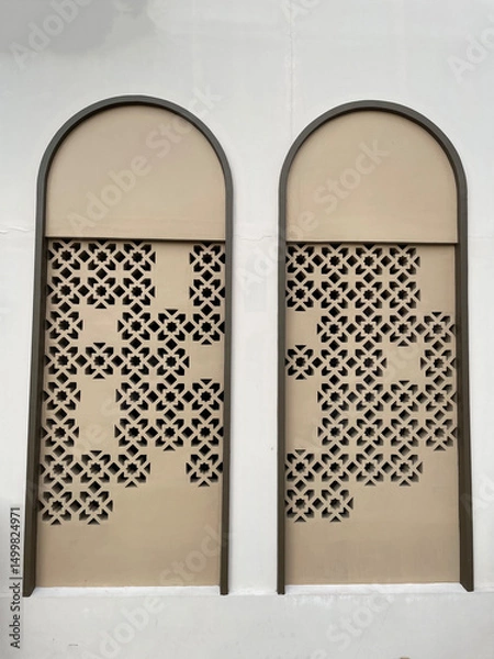 Fototapeta Arched building window with pattern inside