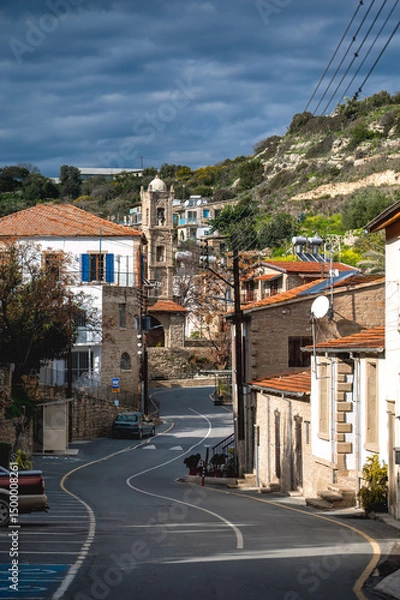 Obraz Winding road passing through Tochni village in Cyprus under cloudy sky