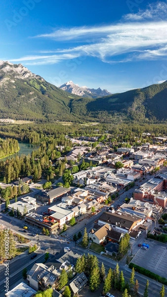 Fototapeta Stunning aerial view of Banff and surrounding valley in summer sunlight