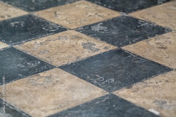 Fototapeta Black and white checkered tiles creating a classic geometric pattern