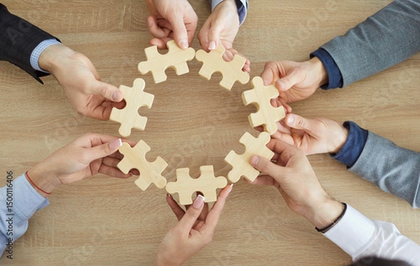 Fototapeta Common unity team jigsaw puzzle circle matching, business teamwork game pieces showing cooperation partnership, hands close up join pieces in office, business people together for team business idea 