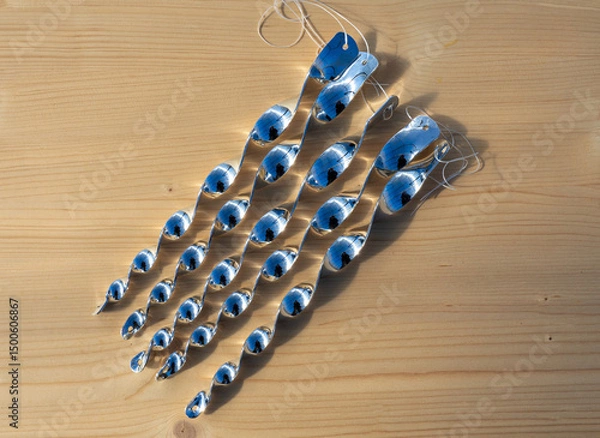 Fototapeta Plastic spiral bird repellent set. Protecting the orchard from birds. Lightweight and wind moving rods