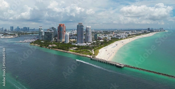 Fototapeta Aerial view of Miami Beach skyline. Drone shot of Miami Beach cityscape. Top view of South Miami Beach and the ocean. Miami Beach skyline with skyscrapers and coastline from above.