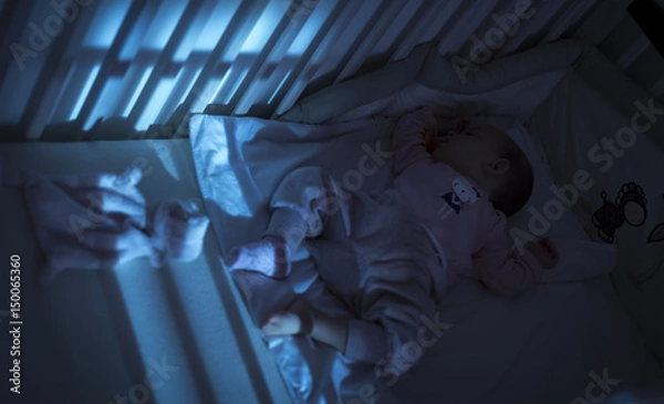 Obraz Adorable baby sleeping in blue at night