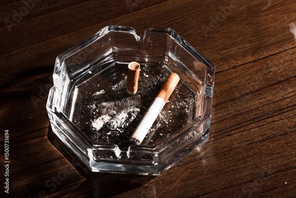 Obraz Burning cigarette with smoke and concept of cigarettes 
