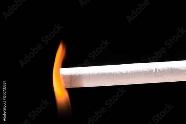 Obraz Burning cigarette with smoke and concept of cigarettes 