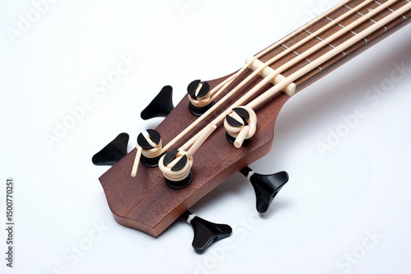 Obraz Four-string bass ukulele with wooden body and built-in tuner and pickup.