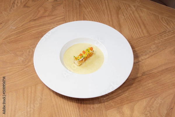 Fototapeta Fine Dining Cream Soup with Gourmet Garnish on White Plate